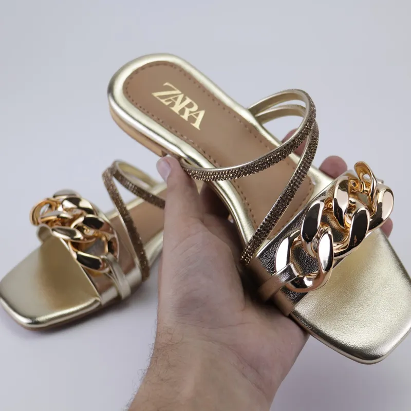 Sparkling Statement Sandals: Flat Heels with Gold Chains and Rhinestones